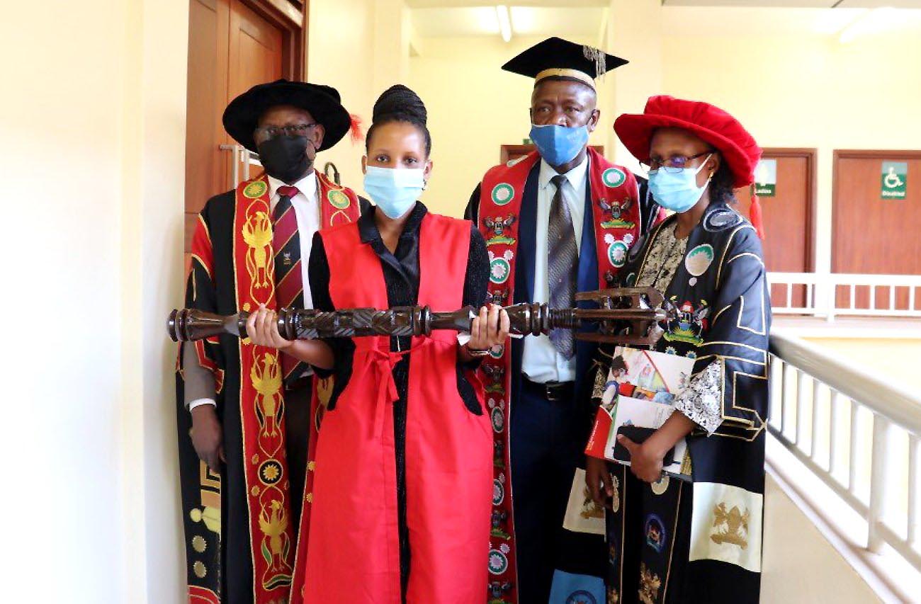 The Vice Chancellor, Prof. Barnabas Nawangwe (L) with the Academic Registrar, Mr. Alfred Masikye Namoah (2nd R), MUBS Registrar, Ms. Eldred Kyomuhangi-Manyindo (R) and the Mace Bearer (2nd L) on Day 4 of the 71st Graduation Ceremony, CTF1, Makerere University.