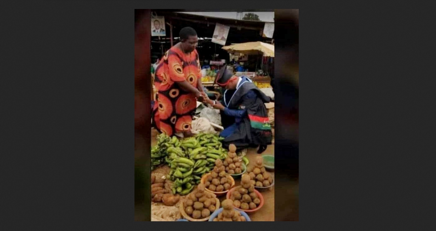A Makerere University Graduate visits his mother in the market after securing his qualification. Courtesy Photo