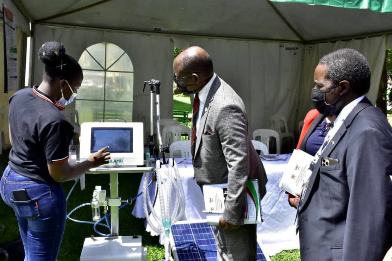 The Vice Chancellor, Prof. Barnabas Nawangwe (C), Mak-RIF GMC Chairperson, Prof. William Bazeyo (R) and other officials inspect the latest version of the low-cost Medical Ventilator (Bulamu Ventilator) during the Open Day on 25th May 2021, CHS, Mulago Campus, Makerere University.