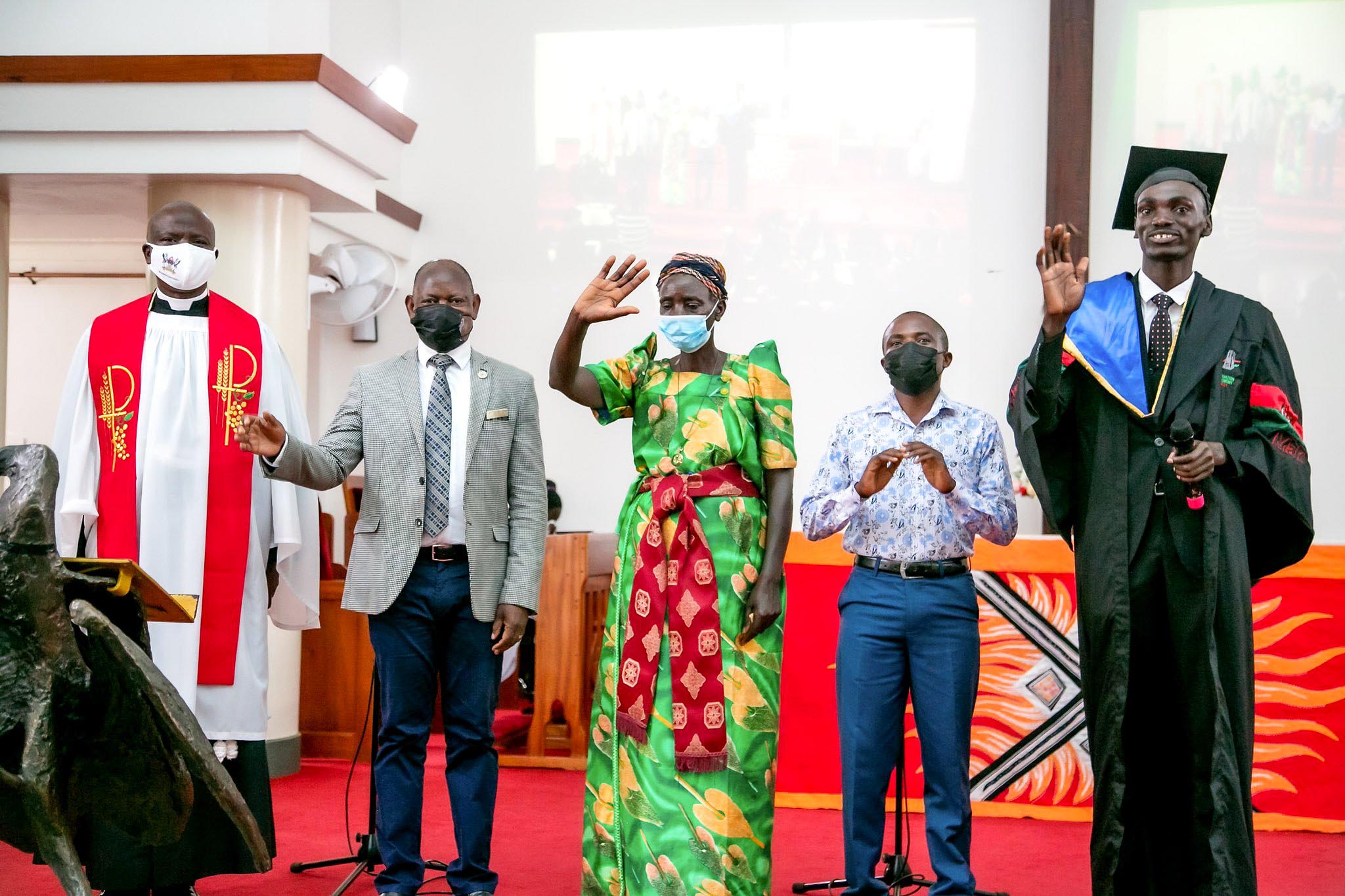 The Vice Chancellor, Prof. Barnabas Nawangwe (2nd L) and the Chaplain, Rev. Can. Onesimus Asiimwe (L) with #Mak71stGrad's best Bachelor of Commerce Student, Mr. Mpireyenki Aaron (R) and his family during the service on 23rd May 2021, St. Francis Chapel, Makerere University.