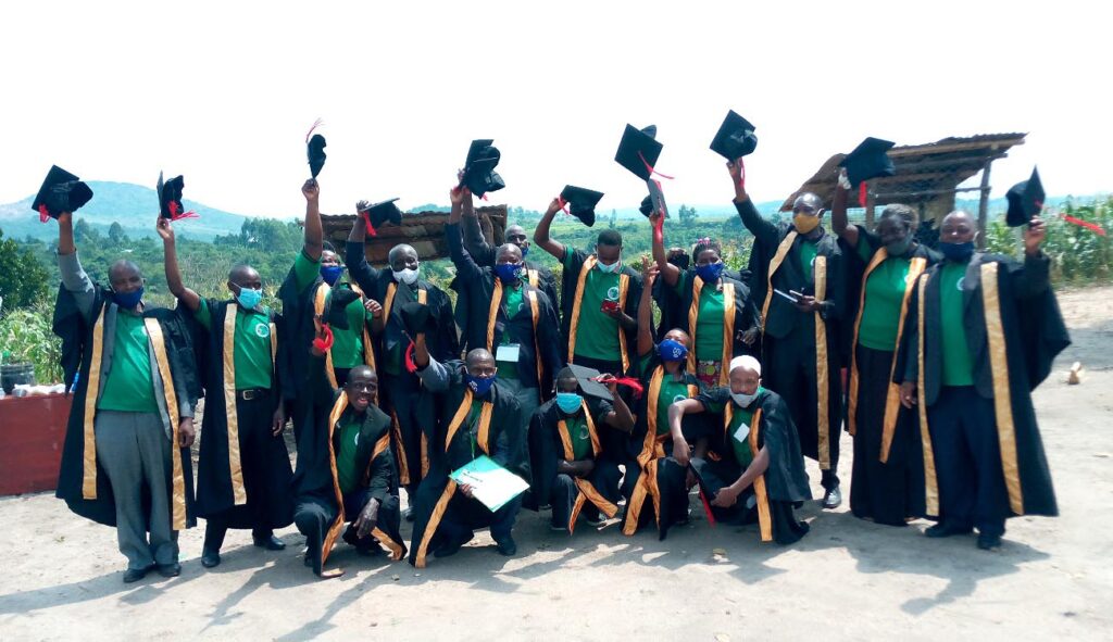 Awardees from the Mubende Incubation Hub raise their caps after virtually receiving their certificates in the blended ceremony on 17th June 2021. Photo credit: Kabaruli Twekambe/Team BOBOMAK