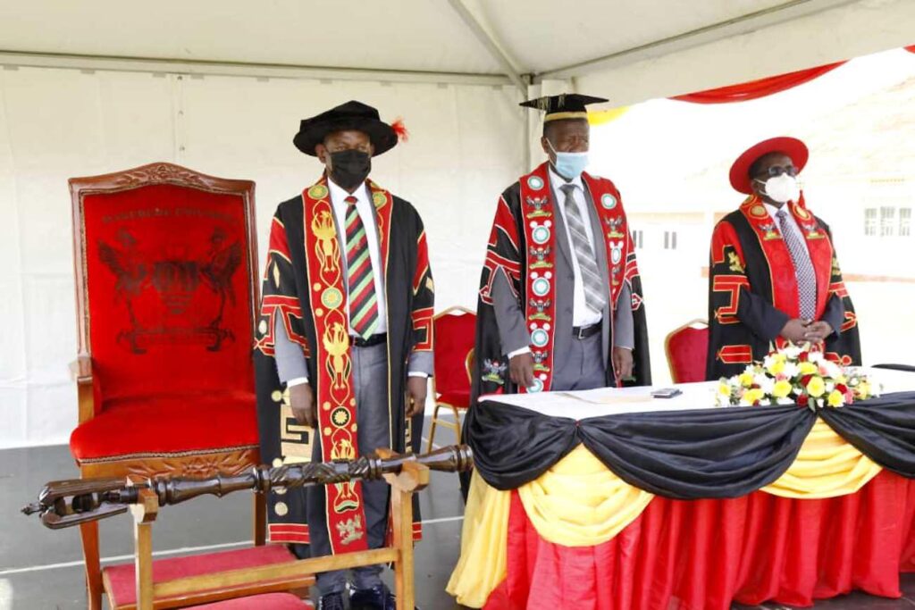 The Vice Chancellor-Prof. Barnabas Nawangwe (L), Academic Registrar-Mr. Alfred Masikye Namoah (C) and the Principal CoVAB-Prof. John David Kabasa stand for the anthems. 