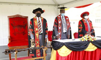 The Vice Chancellor-Prof. Barnabas Nawangwe (L), Academic Registrar-Mr. Alfred Masikye Namoah (C) and the Principal CoVAB-Prof. John David Kabasa stand for the anthems at the CoVAB Golden Jubilee Celebrations Commissioning on 17th June 2021, Nakyesasa.