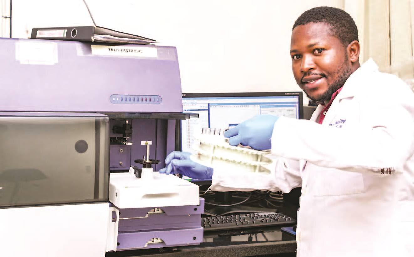 A male technician in one of the Research Labs at the Infectious Diseases Institute (IDI), Makerere University. Photo credit: Miriam Namutebi, Moses Nsubuga/New Vision