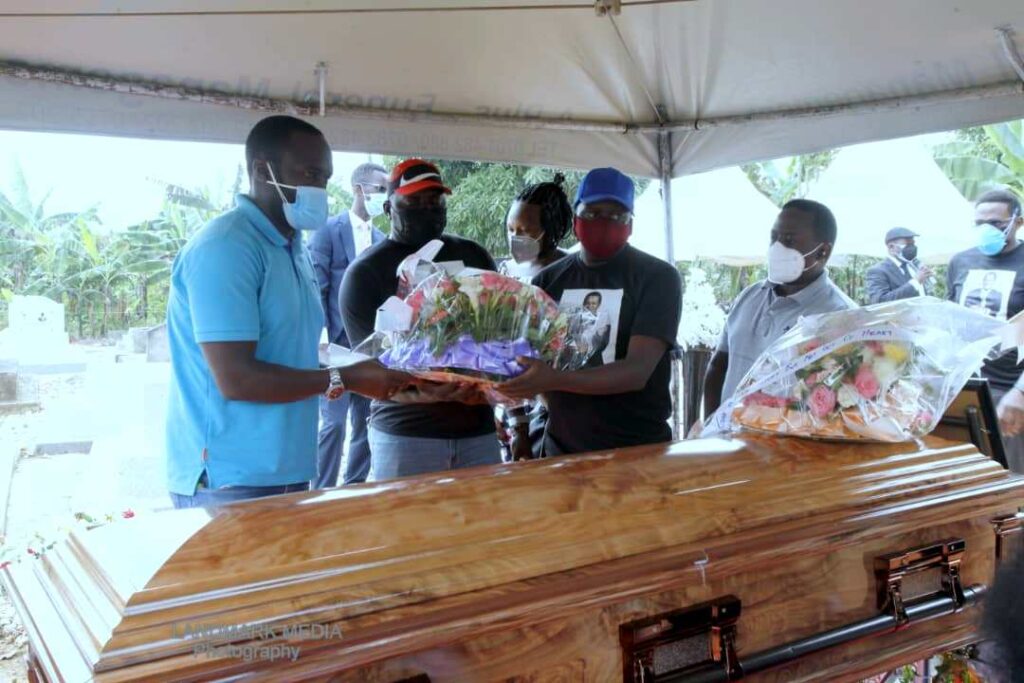Family members lay their wreath on Prof. Banadda's casket
