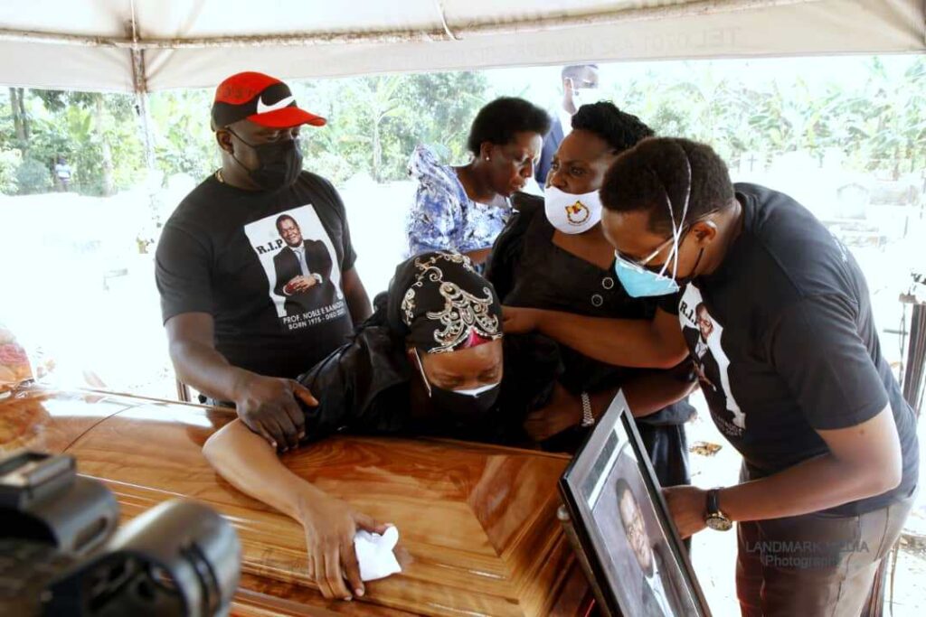 Dr. Beatrice Banadda pays her last respects to her husband.