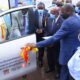 Hon. Bright Rwamirama (L) commissions the car handed over by IDI Executive Director-Dr. Andrew Kambugu (L) to the Dairy Development Authority to the support AMR programme on 5th May 2021, DDA Headquarters, Kampala.