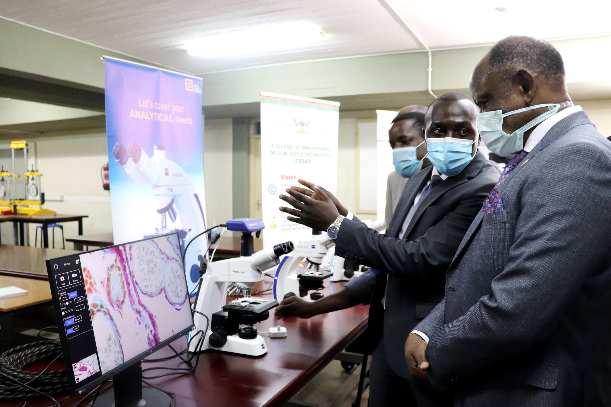 The Vice Chancellor, Prof. Barnabas Nawangwe (R) and other officials at the inauguration of the Vapour Pressure Sigma 300 High Resolution Scanning Electron Microscope, 21st July 2021, CEDAT, Makerere University.