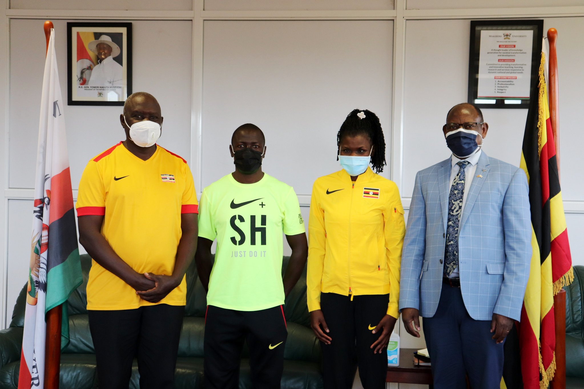 The Vice Chancellor, Prof. Barnabas Nawangwe (R) with Ms. Oroma Peace (2nd R) and members of Team Uganda during the flag-off ceremony to the Tokyo, Japan Paralympics, 19th July 2021, CTF1, Makerere University.