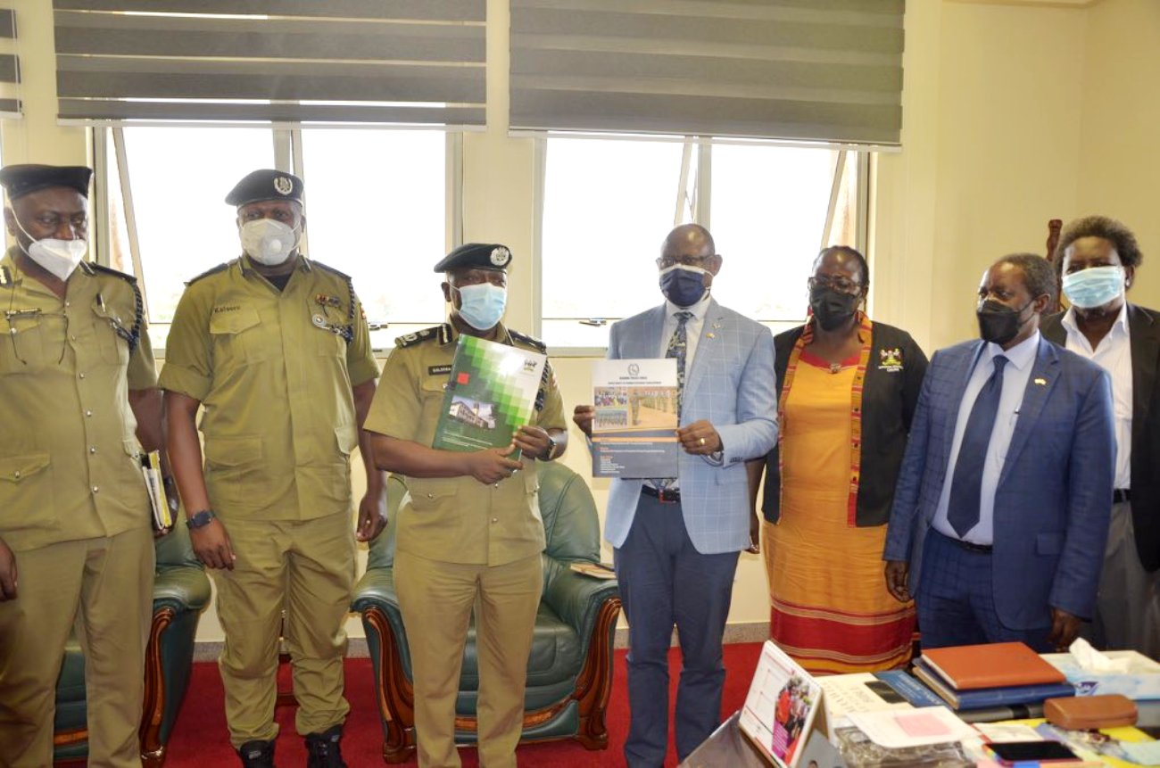 The Vice Chancellor, Prof. Barnabas Nawangwe (4th R) with R-L: Dr. Patrick Mangeni, Prof. William Bazeyo and Dr. Josephine Ahikire and a team from the Uganda Police Force (Left) after the MoU signing ceremony on 19th July 2021, CTF1, Makerere University.