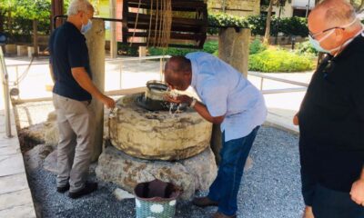 The Vice Chancellor, Prof. Barnabas Nawangwe (C) washes his face in the holy water from the well at St. Paul's house in Tarsus, Turkey on 8th July 2021.