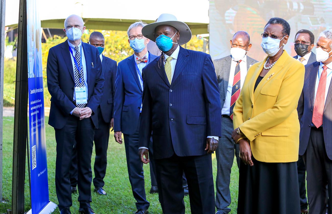 The President of the Republic of Uganda H.E. Yoweri Kaguta Museveni flanked by the First Lady & Minister of Education and Sports Hon. Janet Kataaha Museveni inspect exhibitions at the WHS Regional Meeting Africa on 27th June 2021, Speke Resort Munyonyo, Kampala. Left is President WHS & M8 Alliance-Prof. Axel Pries, 2nd Left is German Ambassador to Uganda-H.E. Matthias Schauer, Right is WHO Country Representative to Uganda-Dr. Yonas Tegegn Woldemariam while 4th Right is the Vice Chancellor-Prof. Barnabas Nawangwe.