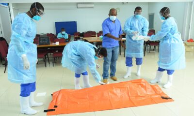 Some of the participants in the Virtual Safe and Dignified Burials Training organised by the GHS Programme, IDI, Makerere University sanitize as part of IPC on 14th July 2021.