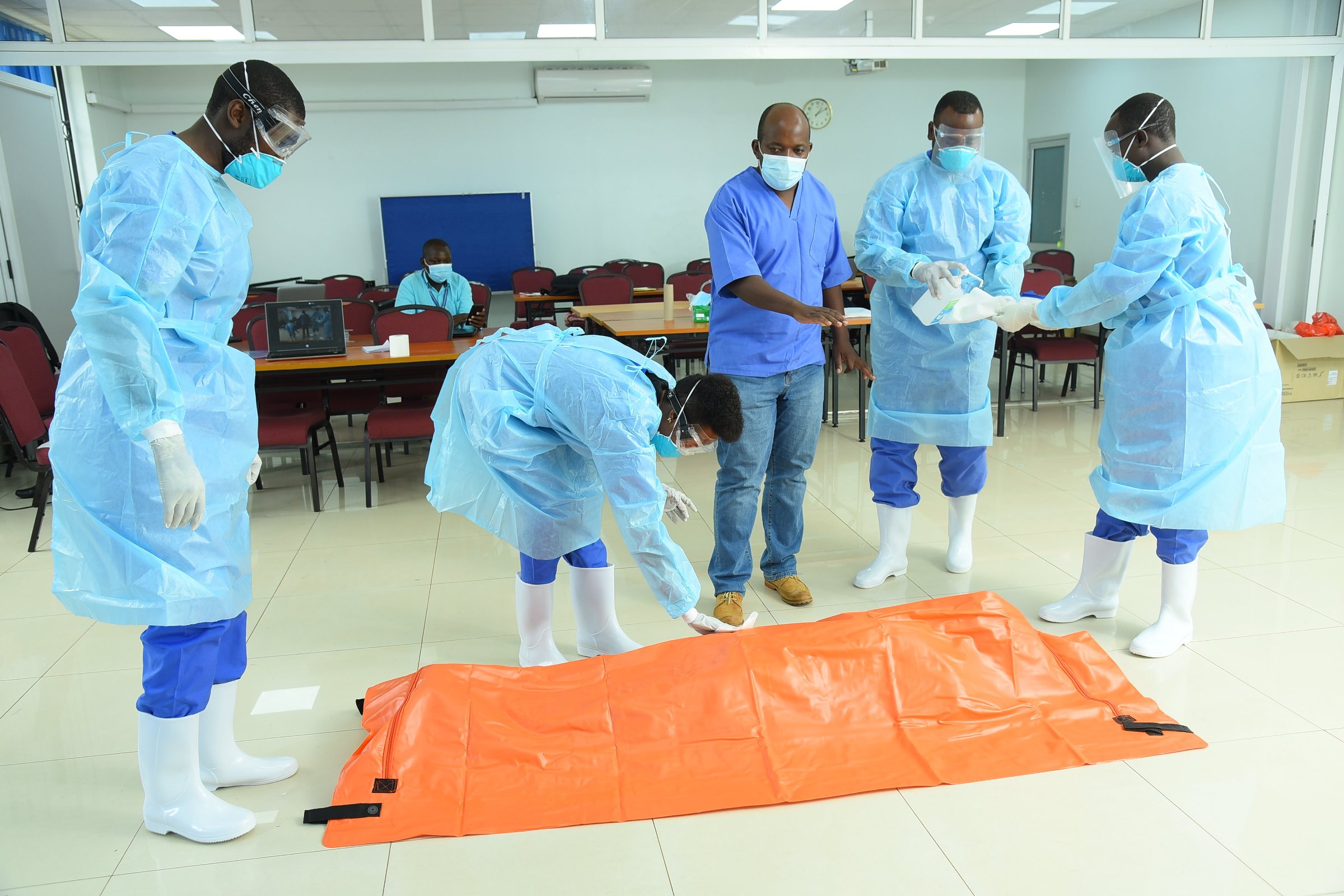 Some of the participants in the Virtual Safe and Dignified Burials Training organised by the GHS Programme, IDI, Makerere University sanitize as part of IPC on 14th July 2021.