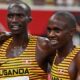 Joshua Cheptegei (L) and Jacob Kiplimo (R) embrace after finishing second and third respectively in the men's 10000m final of the Tokyo 2020 Olympic Games, 30th July 2021. Photo: AFP