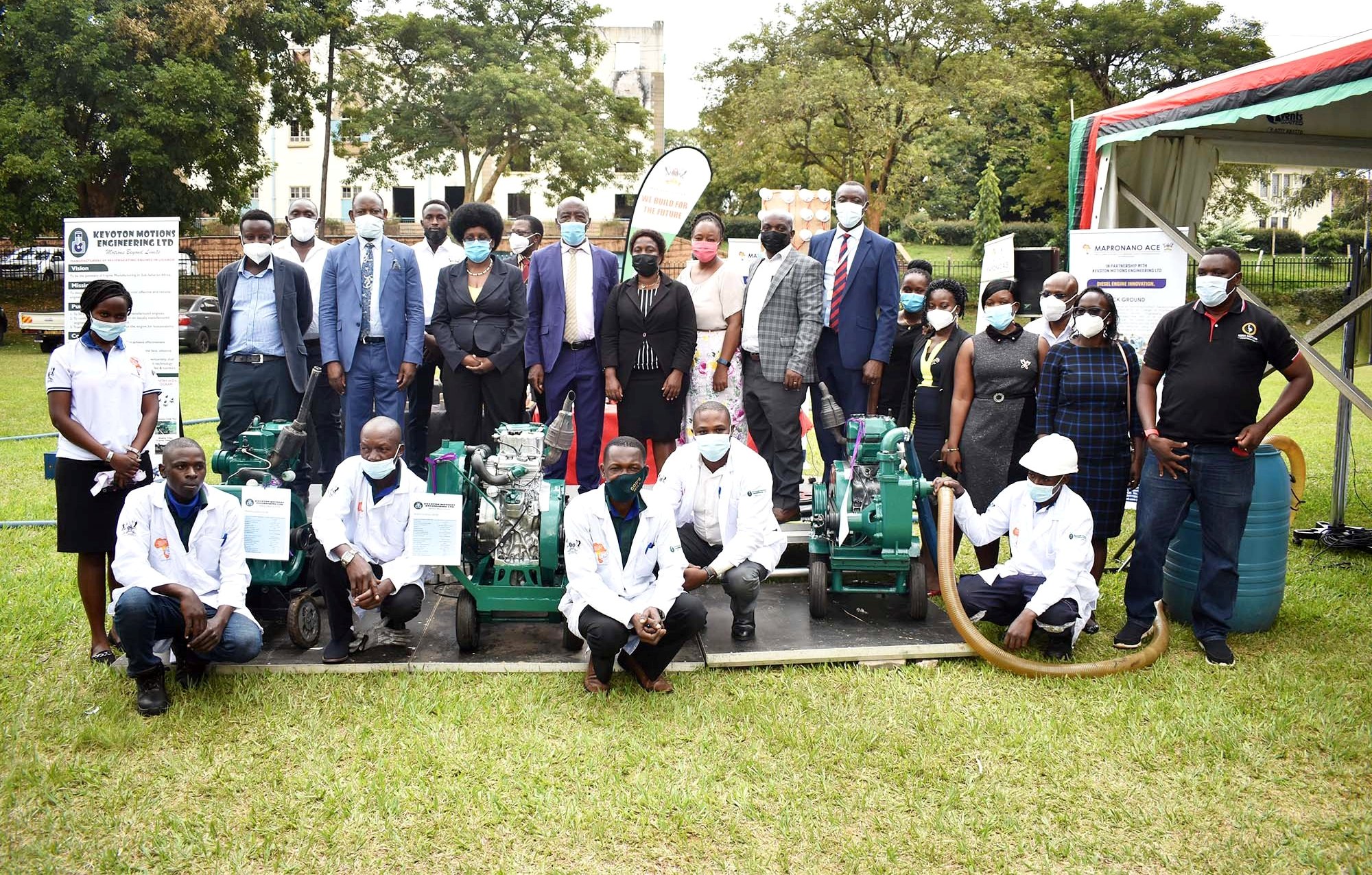 Hon. Dr. Monica Musenero (3rd L) with the Vice Chancellor, Prof. Barnabas Nawangwe (2nd L), Principal CEDAT-Prof. Henry Alinaitwe (4th L), college leadership, MAPRONANO’s Prof. John Baptist Kirabira (7th L), Kiira Motors’ Mr. Paul Isaac Musasizi (R), Kevoton Motions Engineering Team (in white) and other officials at the launch on 19th August 2021, Freedom Square, Makerere University.