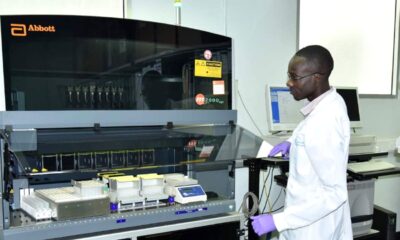 One of the staff uses the Abbott m2000 RealTime System in the Core Laboratory (CL), IDI, Makerere University.