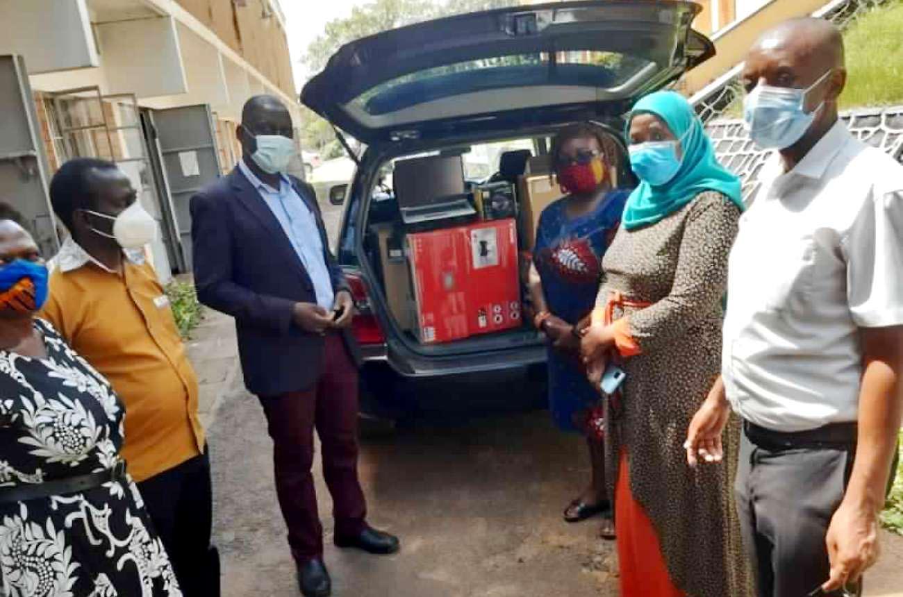 Staff from the Department of European and Oriental Languages led by the Head, Dr Edith Natukunda - Togboa (3rd R) receiving online training equipment from the French Embassy FSPI Project. The handover event was witnessed by the Principal, Dr Josephine Ahikire; Ag. Deputy Principal of CHUSS, Dr Julius Kikooma (3rd L) and the Dean, School of Languages, Literature & Communication, Dr. Saudah Namyalo (2nd R).