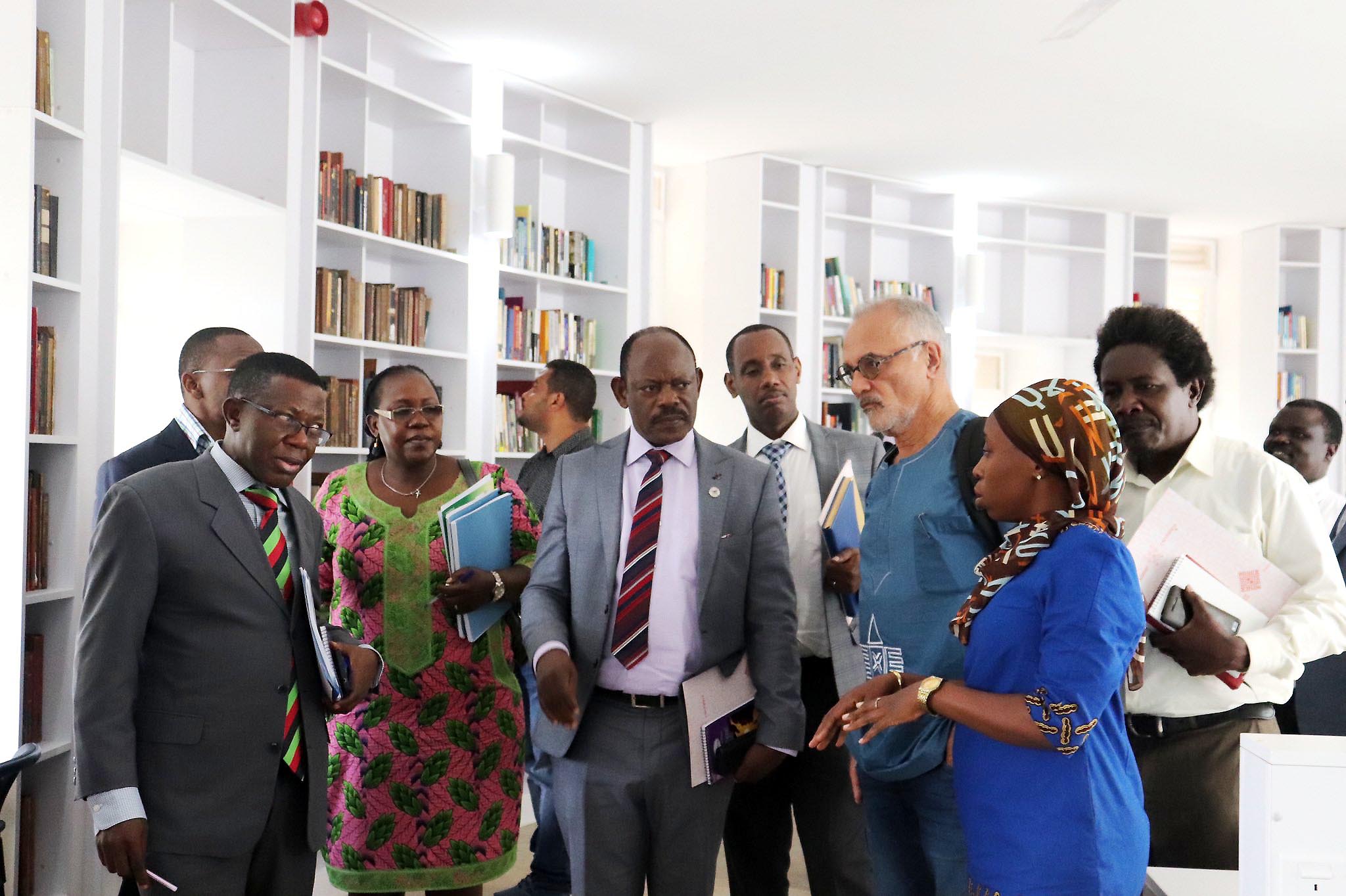 The Vice Chancellor-Prof. Barnabas Nawangwe (C), Director MISR-Prof. Mahmood Mamdani (3rd R) and other members of Management tour the MISR Library on 5th June 2019, Makerere University.