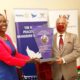 The Chairperson of Council, Mrs Lorna Magara (L) presents a plaque to Rotary International President Shekhar Mehta in appreciation of his visit and invaluable service, 15th September 2021, CTF1, Makerere University.
