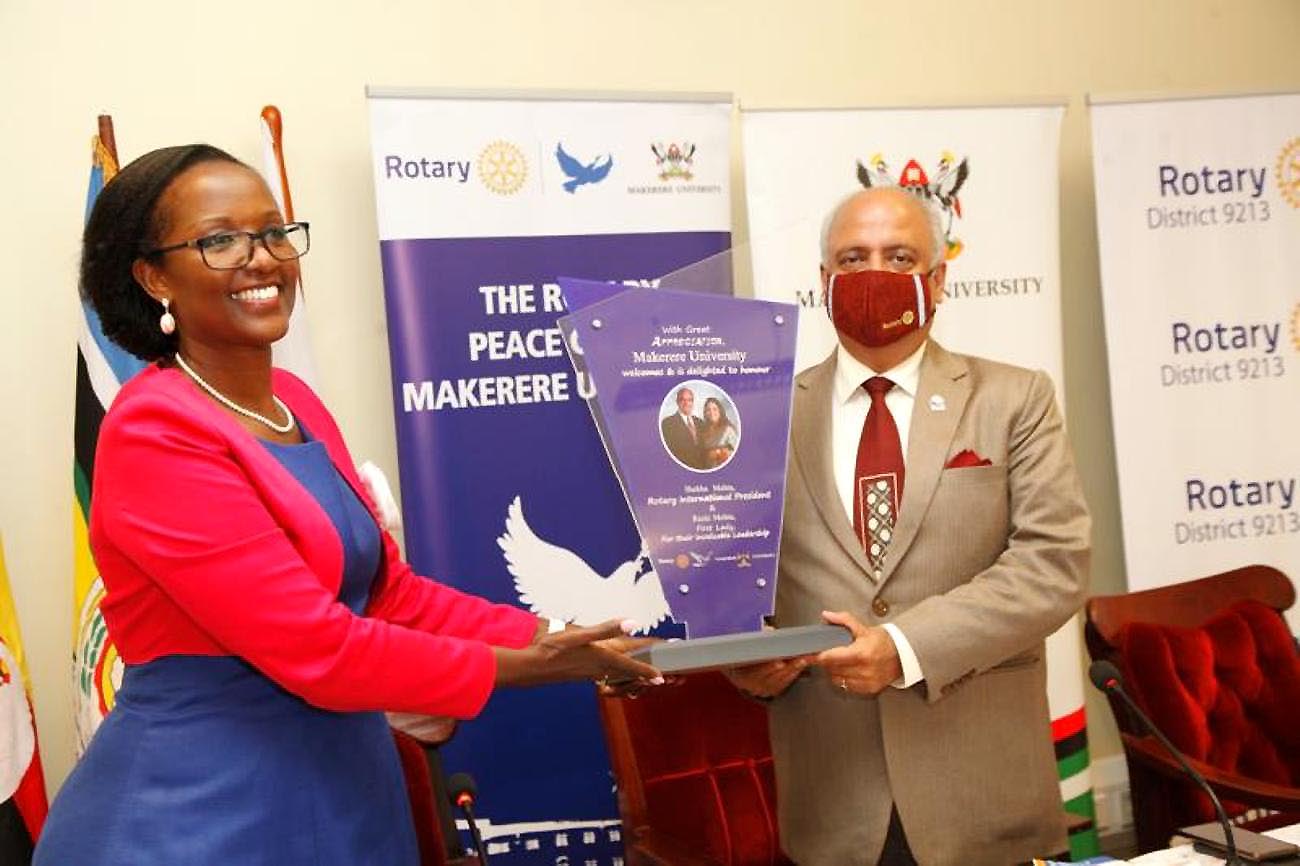 The Chairperson of Council, Mrs Lorna Magara (L) presents a plaque to Rotary International President Shekhar Mehta in appreciation of his visit and invaluable service, 15th September 2021, CTF1, Makerere University.