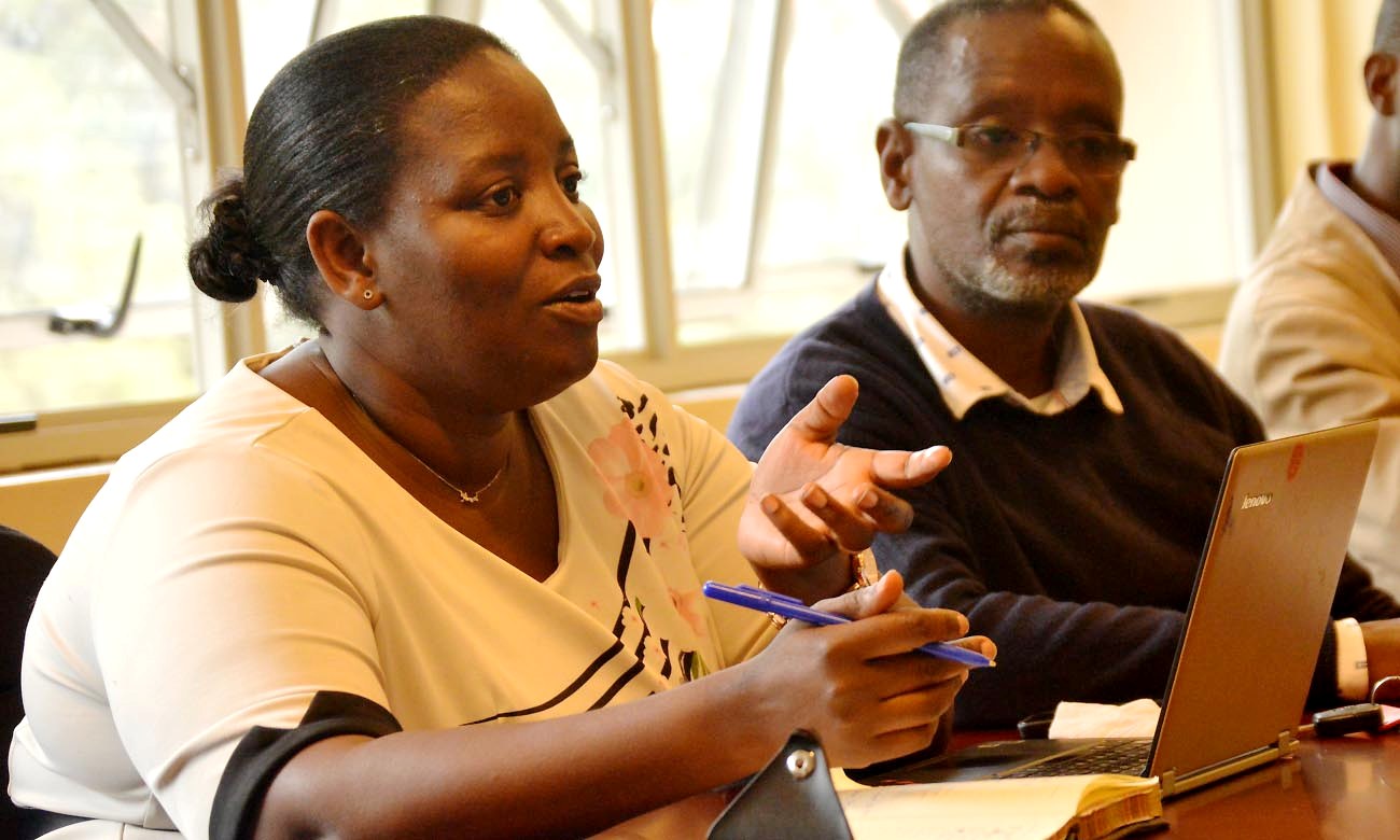 Director of the International Rotary Peace Centre at Makerere University, Dr. Helen Nambalirwa Nkabala with colleagues at a meeting.