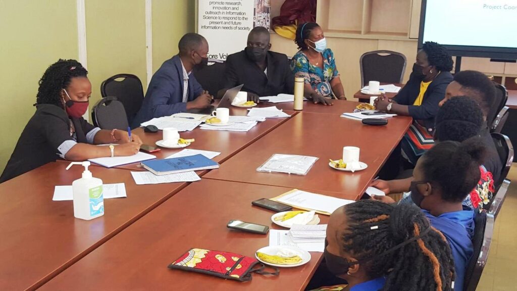 Prof. Constant Okello Obura (Dean, EASLIS) and Richard Batte (Project coordinator) discuss and address questions from the students