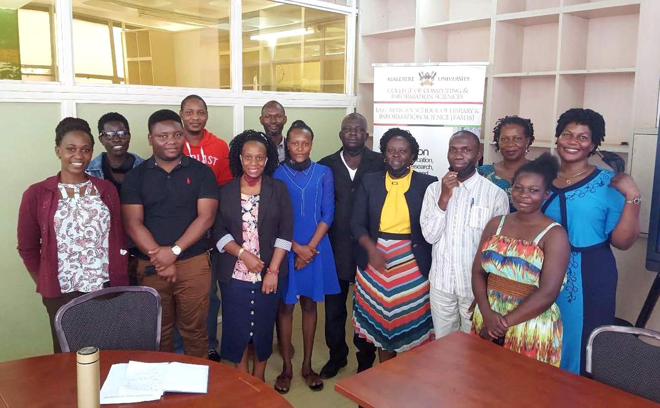 The six scholarship students take a group photo with the Deputy Principal CoCIS-Dr. Dr. Rwashana Semwanga (5th R), Dean EASLIS-Prof. Constant Okello-Obura (6th R), Dr. Joyce Bukirwa (R), Ms. Martha Muwanguzi (3rd R), Mr. Charles Batte (2nd Row 3rd L) and the EASLIS team after being briefed on 1st September 2021, EASLIS, Makerere University.