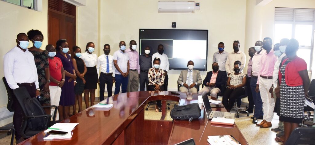 Participants pose for a group photo with EfD-Mak Centre Director Prof. Edward Bbaale after the seminar.