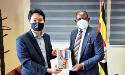 The Vice Chancellor, Prof. Barnabas Nawangwe (R) receives a copy of the Korean Journal 'Tomorrow' from James Kim, IYF Representative in Uganda, 17th September 2021, CTF1, Makerere University.