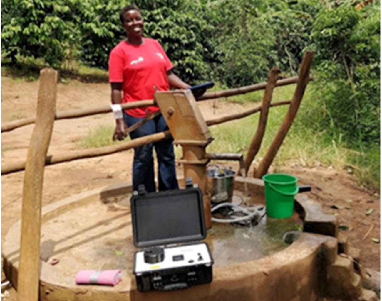 Use of portable fluorimeter to test the quality of water sampled from a shallow well by co-author Jacintha Nayebare in Lukaya Town, Uganda.