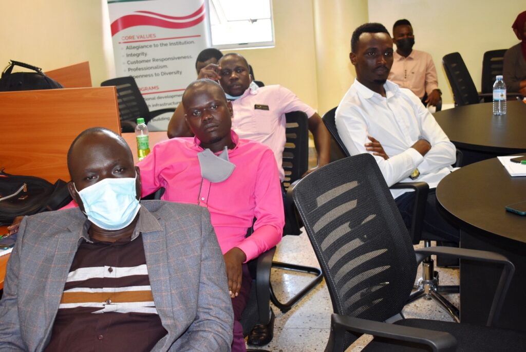 A section of male participants listens to the proceedings during the traiA section of male participants listens to proceedings during the training. ning. 