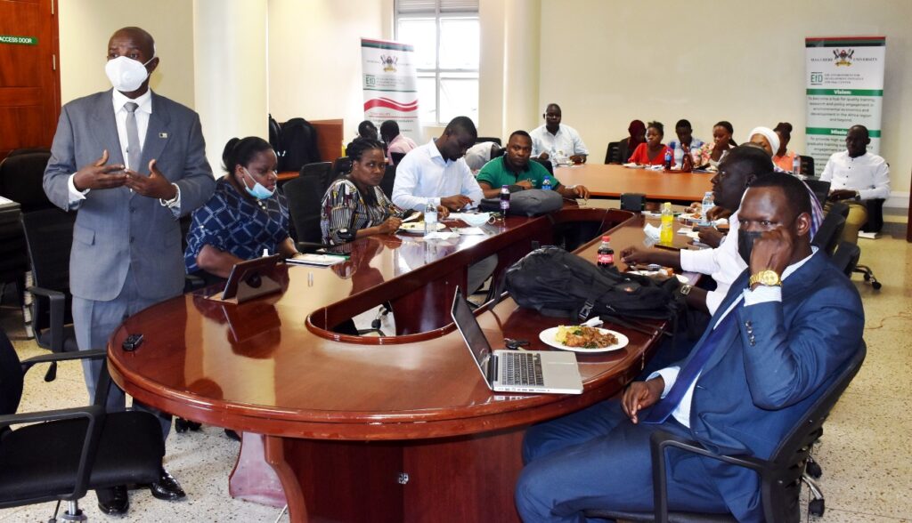 Prof. Edward Bbaale (standing) delivers the welcome remarks.