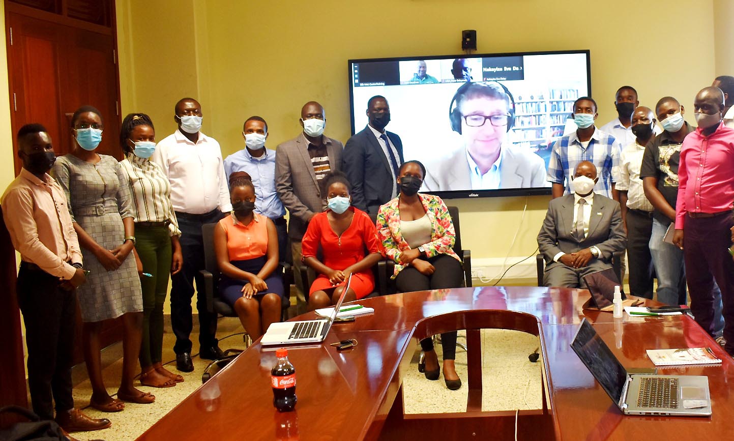 EfD-Mak Director Prof. Edward Bbaale (Seated Right) and some of the participants pose for a group photo with the facilitator Dr. David Fuente (On screen) after the training on 14th October 2021, CTF2, Makerere University.