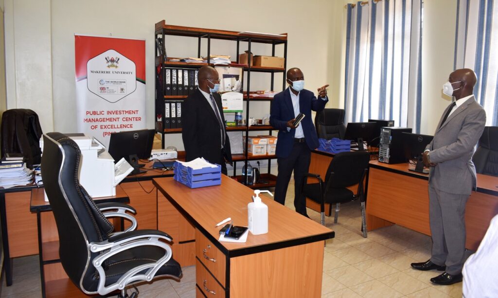 L-R: Dr. Willy Kagarura, Assoc. Prof. Eria Hisali and the PI-Prof. Edward Bbaale tour the PIM CoE office space.