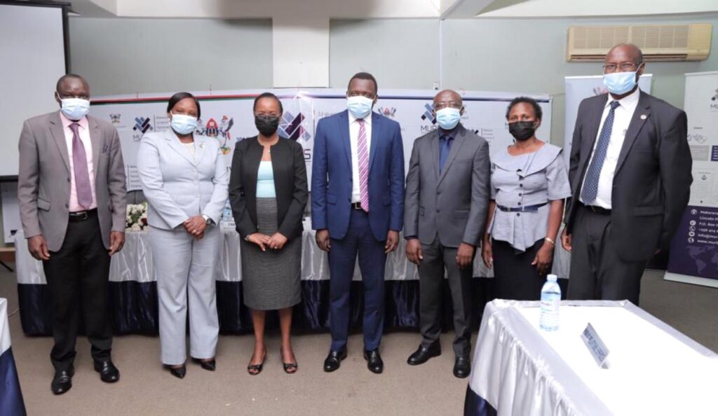 Assoc. Prof. Sarah Ssali (3rd L), URBRA's Mrs. Ritah Nansasi Wasswa (2nd L), University Secretary Mr. Yusuf Kiranda (C) and Chairperson MURBS BoT Dr. Godwin Kakuba (3rd R) with Trustees R-L: Mr. Wilber Grace Naigambi, Ms. Franco Angida Mugyema and Mr. Joseph Ikarokok. 