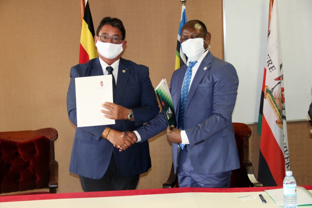 Prof. Barnabas Nawangwe (R) and Prof. Béla Merkely (L) show off the signed MoU aimed at deepening collaboration between Makerere University and Semmelweis University.