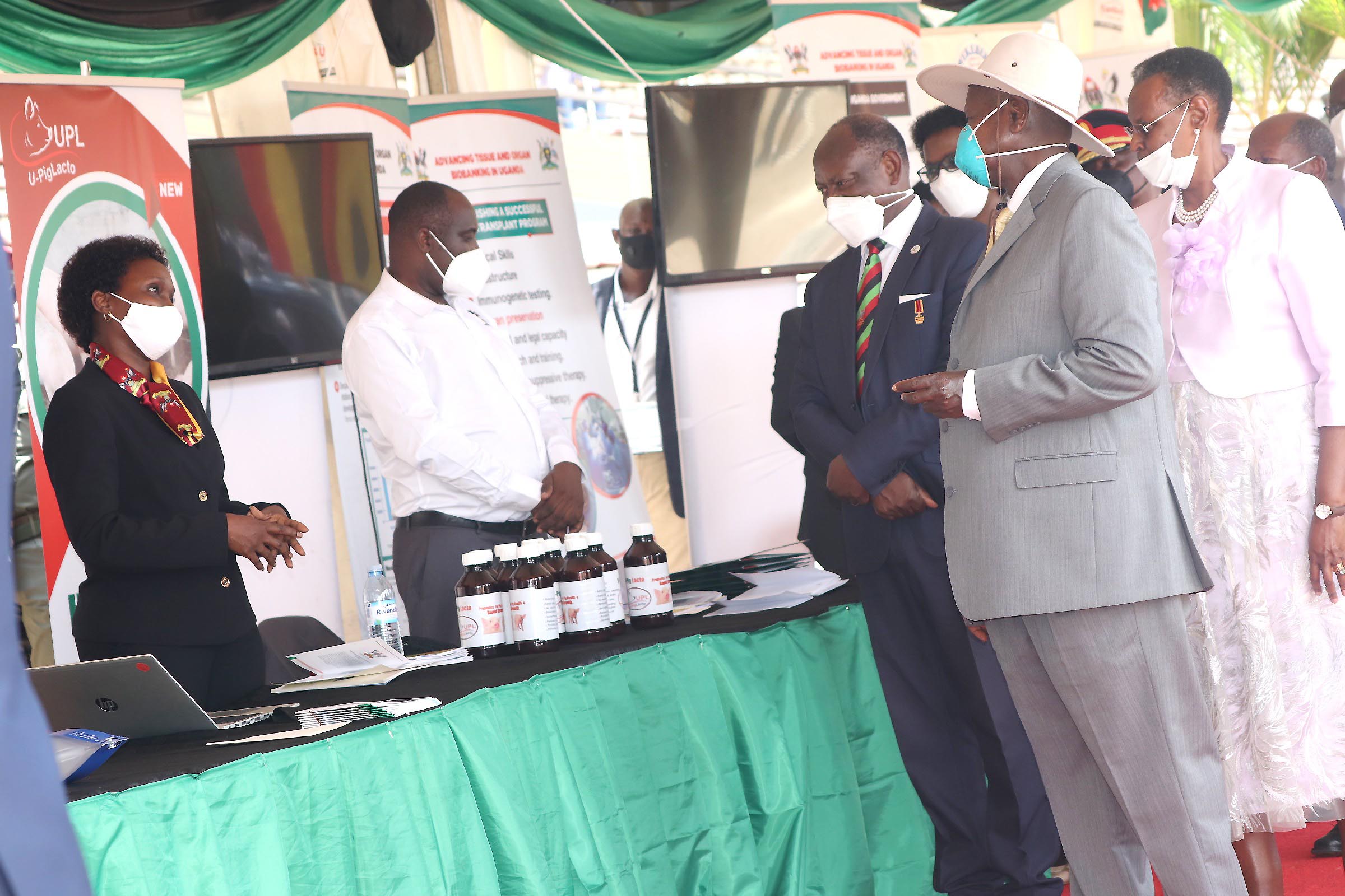 Prof. Josephine Nabukenya (Left) explains how the Makerere University Electronic Human Resource Management System (eHRMS) works to President Yoweri Kaguta Museveni and the First Lady Hon. Janet Museveni as the Vice Chancellor of Makerere University Prof. Barnabas Nawangwe listens.