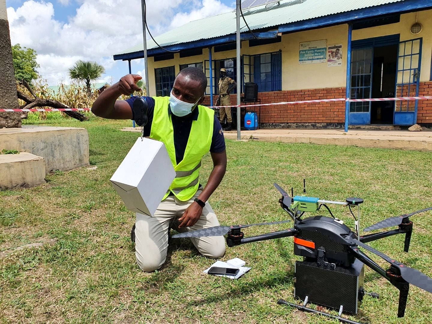 An IDI staff demonstrates how the medical drones will work. Photo credit: UNCDF