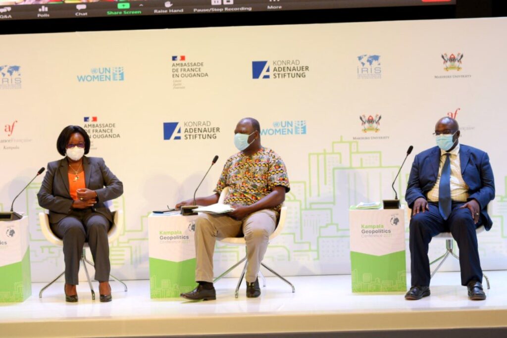 Panelists that attended physically; Prof. Rhoda Wanyenze (L) and Mr. Andrew Bakainanga (R) with the Moderator Dr. Milton Mutto (C).