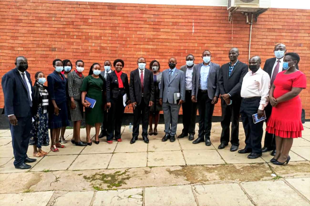 The DVCFA-Dr. Josephine Nabukenya (8th L-Red scarf) and Principal CoBAMS-Dr. Eria Hisali (9th L) with Deans and newly oriented staff after the induction exercise on 2nd November 2021, School of Business, Makerere University.