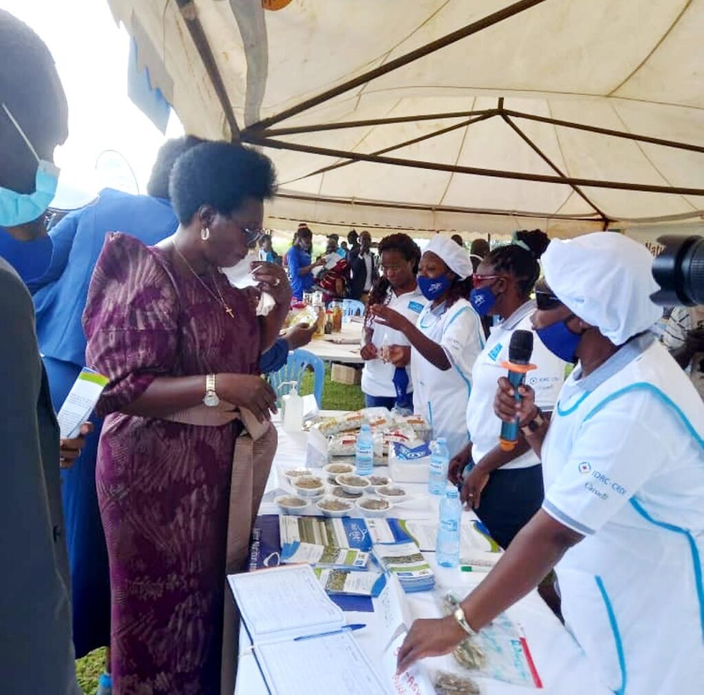 The Minister touring the exhibition stall of NutriFish Uganda, a project under Makerere University Department of Zoology, Entomology and Fisheries, College of Natural Sciences (CoNAS).