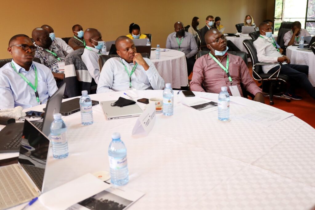 Some of the participants attending the three day workshop listen to proceedings during the Opening Ceremony. 