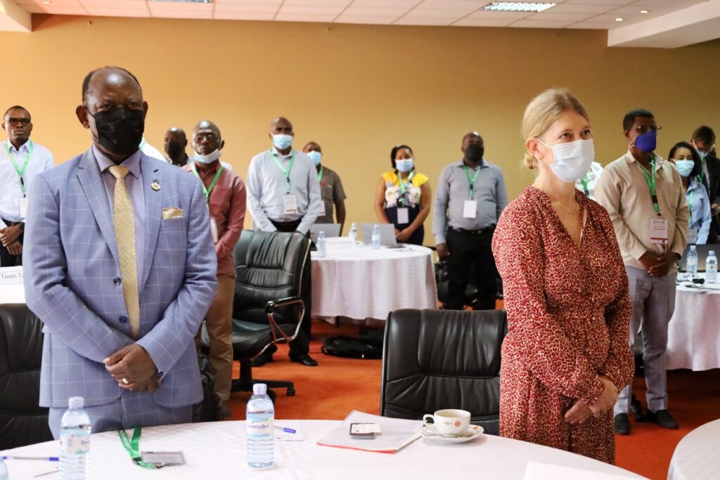 Ambassador Maria Håkansson (R) and Prof. Barnabas Nawangwe stand for the anthems during the opening ceremony of the workshop.