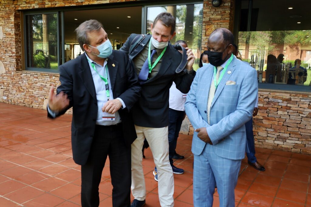 Prof. Barnabas Nawangwe (R) interacts with Director EfD Global Network Assoc. Prof. Gunnar Kohlin (L) and another official after the opening ceremony. 