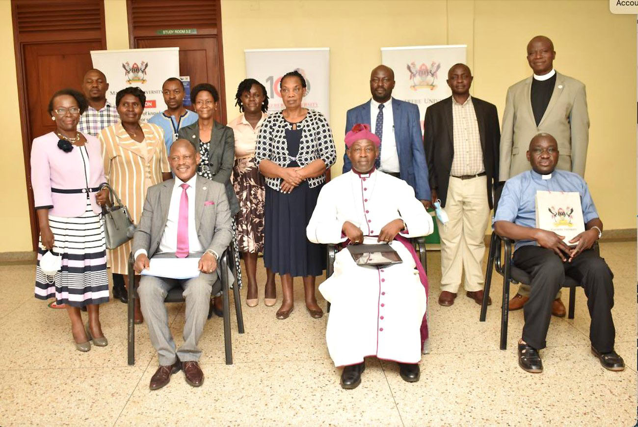 Seated [L-R]: THe Vice Chancellor Prof. Barnabas Nawangwe, His Grace The Archbishop Dr. Stephen Kaziimba Mugalu and the Provincial Secretary Rev. Canon Captain William Ongeng. Standing: Rev. Onesmus Asiimwe - Chaplain St. Francis Chapel (R) together with some of the mobilisers from across different Units of the university after the Love Gift handover ceremony on 20th December 2021, CTF1, Makerere University.