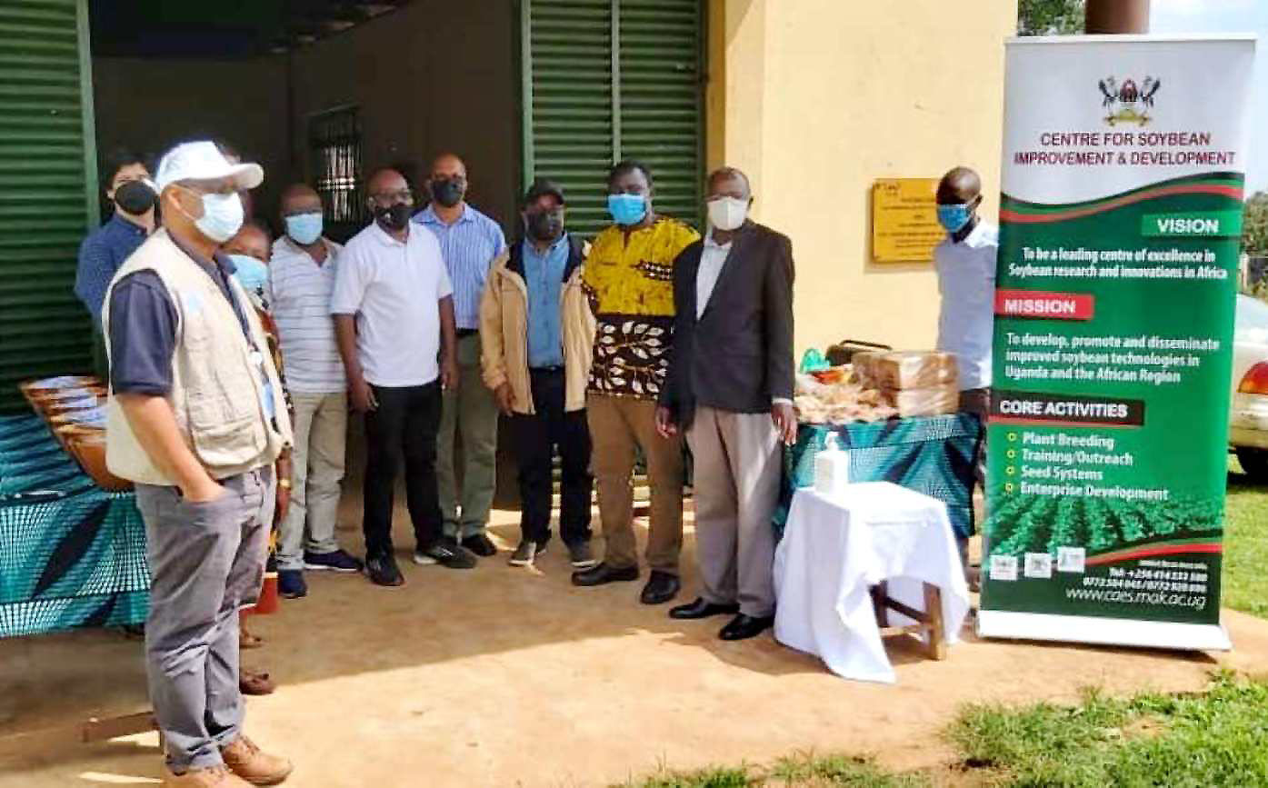 The Principal MakCAES-Prof. Bernard Bashaasha (Black Coat), Prof. Phinehas Tukamuhabwa (Rear blue shirt) during the Soybean Mission hosted by MAKCSID at MUARIK on 24th October 2021.