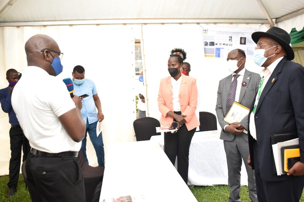 Dr. Nicholas Kiggundu (L) invented the MAKNAI to safeguard the spread of COVID19 at boreholes.