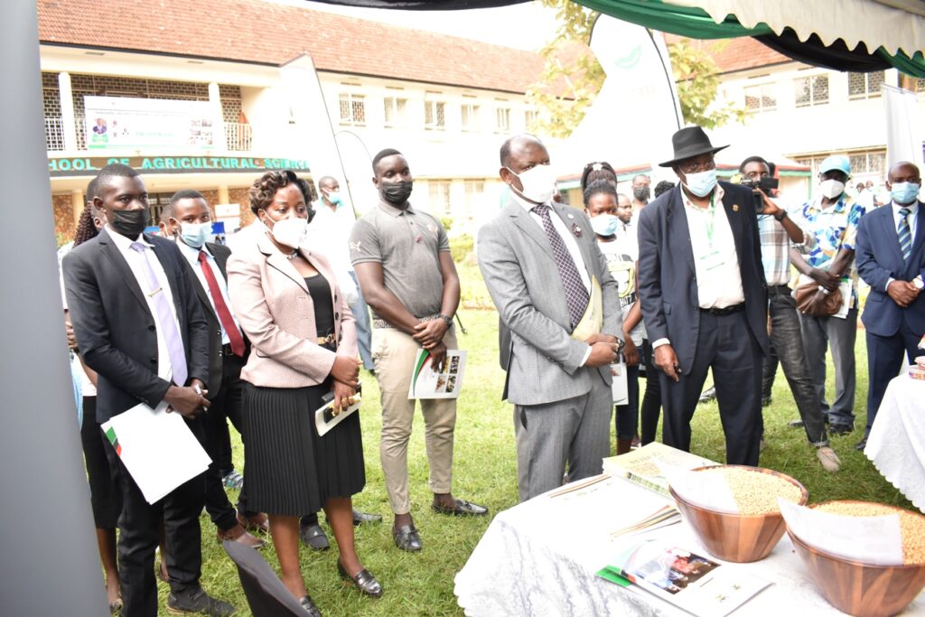 The Vice Chancellor, Prof. Barnabas Nawangwe and Guest of Honour, Maj. Gen. David Kasura Kyomukama touring the exhibition stalls.