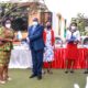 The Dean MakSPH-Prof. Rhoda Wanyenze (L) presents a plaque to Mr. Rudolf Buga (2nd L) as Dr. Esther Buregeya (C), Dr. John C. Ssempebwa (R) and another official witness during Mr. Buga's farewell ceremony held at Piato Restaurant in Kampala on 2nd December 2021.